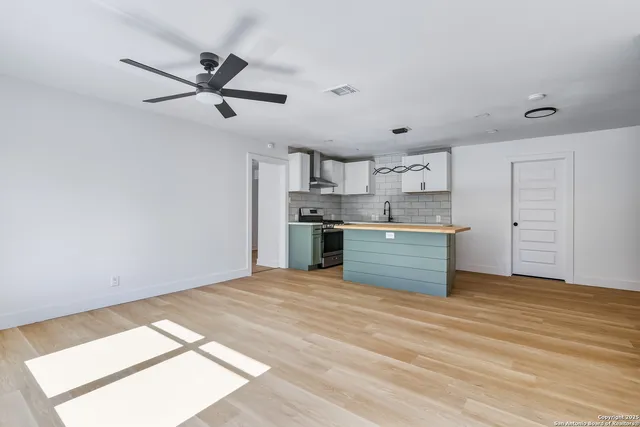 a kitchen with a stove and a refrigerator