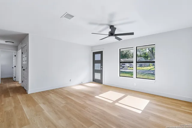 a view of an empty room with a window