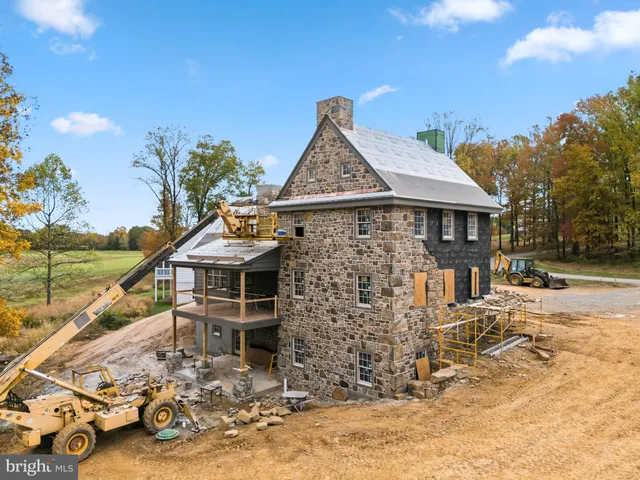 a front view of a house with parking area
