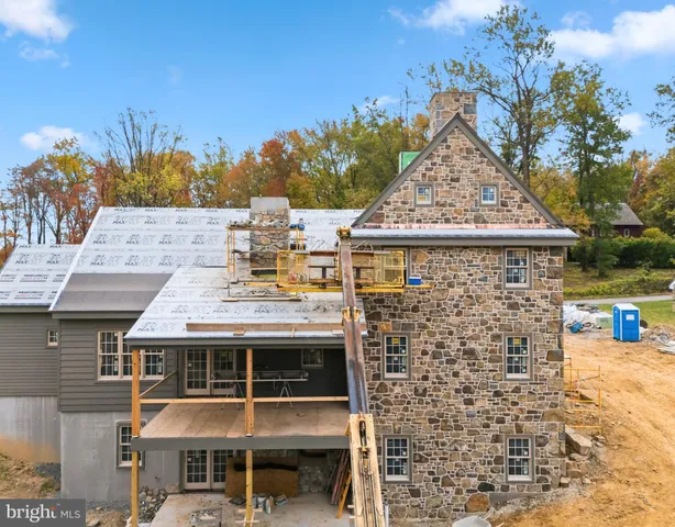 a view of a patio with table and chairs with wooden floor and fence