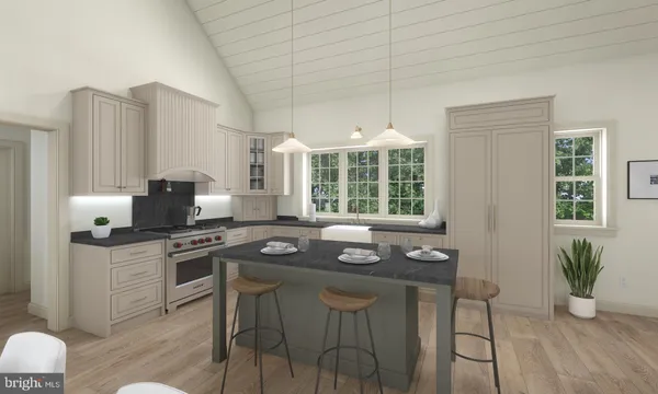 a kitchen with granite countertop a stove a sink and a refrigerator