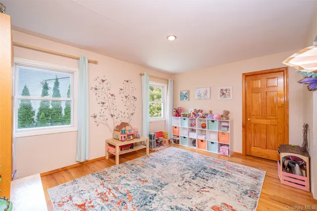 a bedroom with furniture and a window