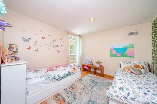 a bedroom with baby bed and bedroom