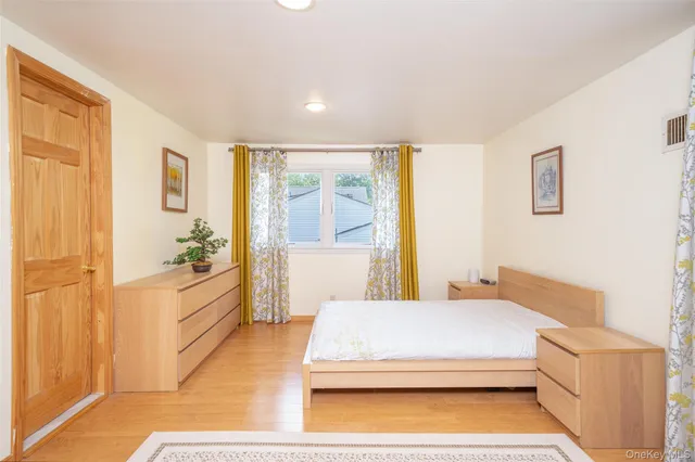 a bedroom with a bed and a cabinets