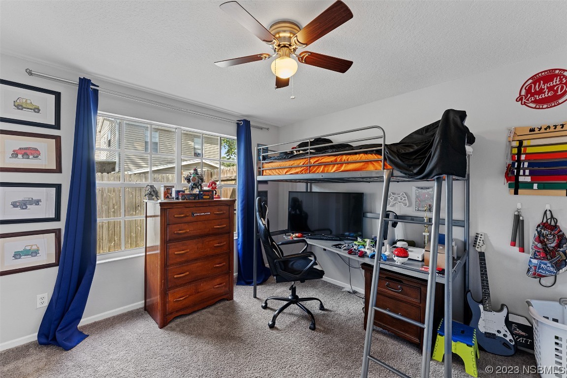 2617 35th Street Edgewater, FL 32141 - Photo 19 of 43 a view of a workspace with furniture and toys