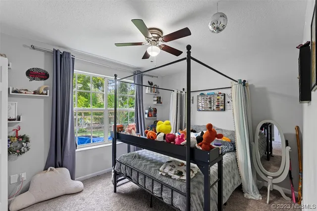 a bed room with furniture and a window