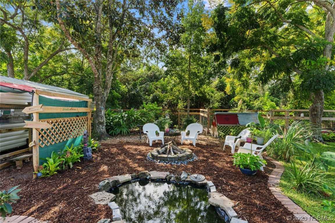 2617 35th Street Edgewater, FL 32141 - Photo 29 of 43 a view of a backyard with sitting area
