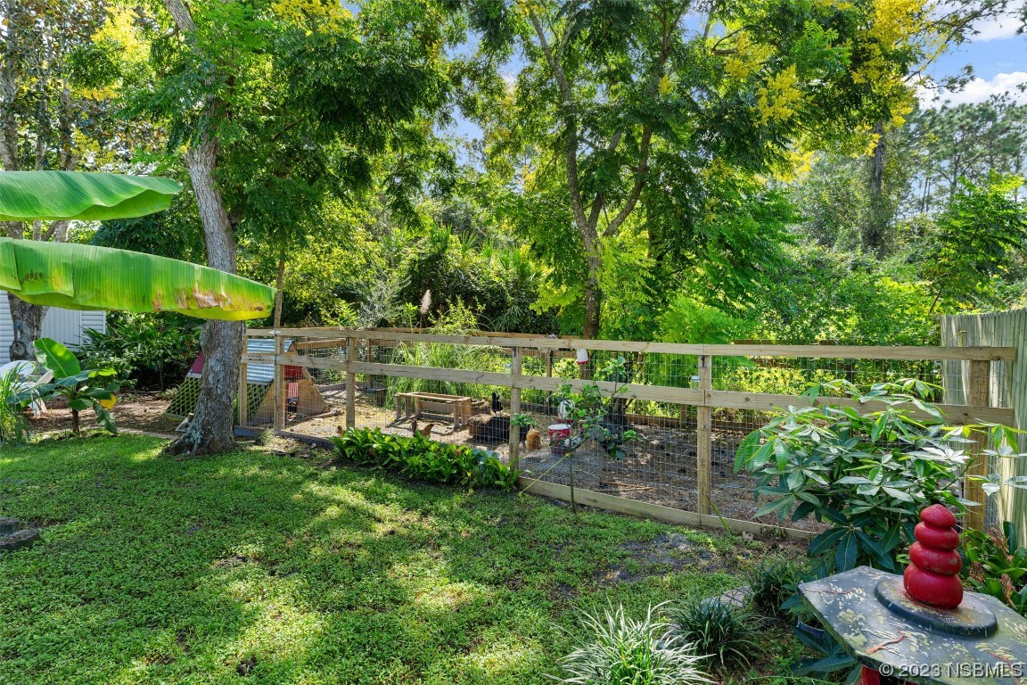 2617 35th Street Edgewater, FL 32141 - Photo 30 of 43 a garden view with a sitting space