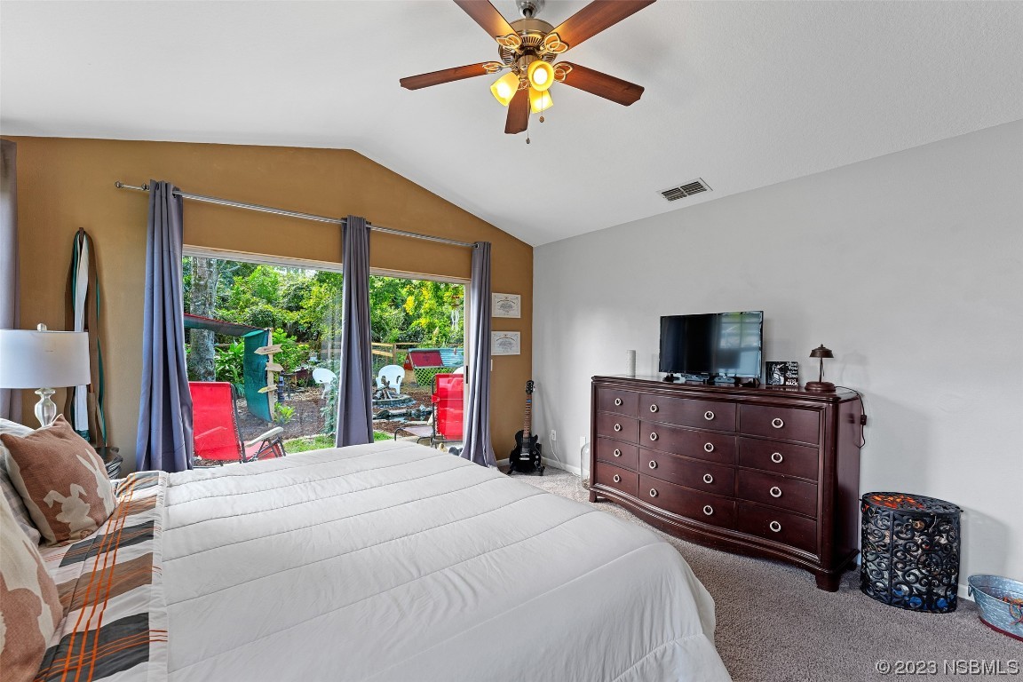 2617 35th Street Edgewater, FL 32141 - Photo 37 of 43 a bed room with a bed and a television