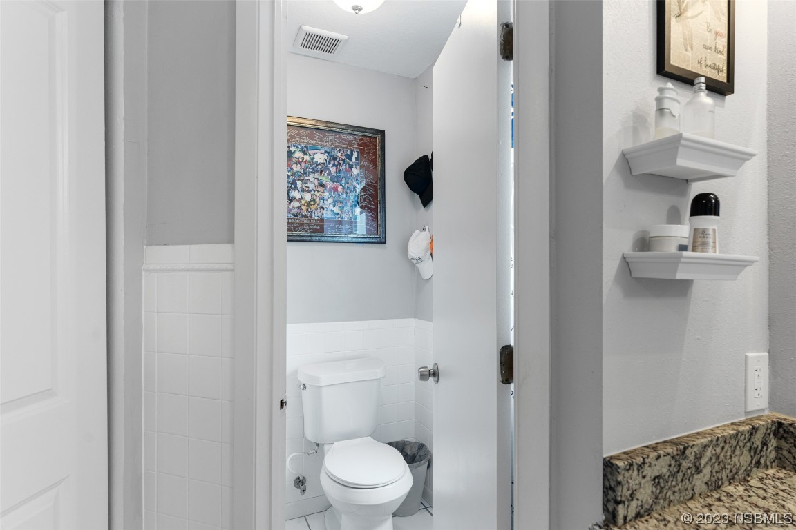 2617 35th Street Edgewater, FL 32141 - Photo 40 of 43 a bathroom with a toilet and a shower