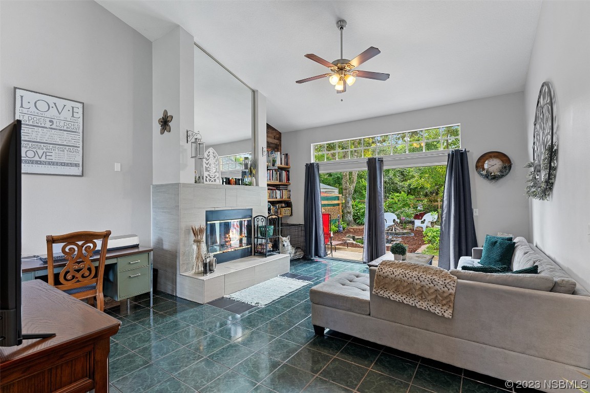 2617 35th Street Edgewater, FL 32141 - Photo 6 of 43 a living room with furniture and a large window