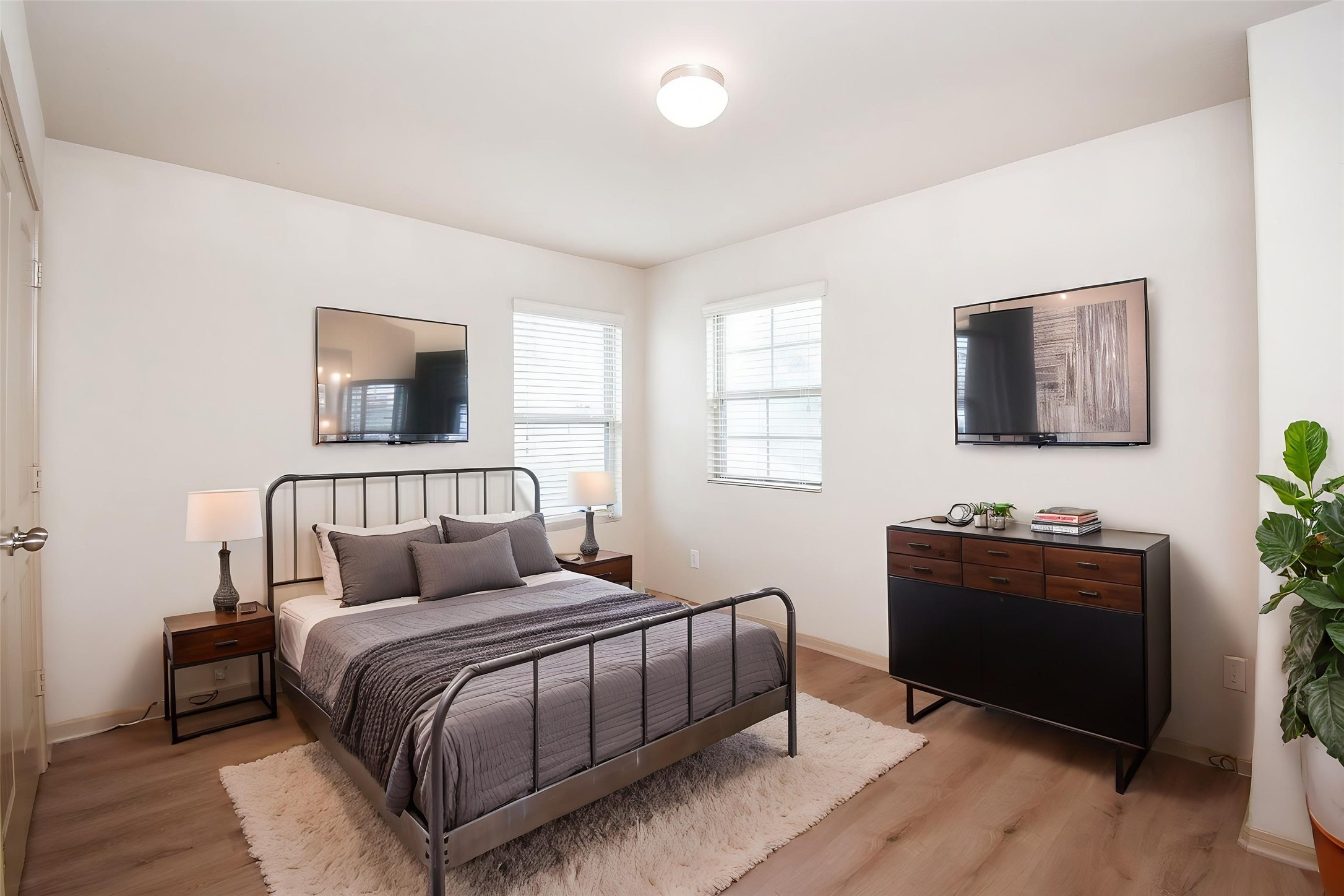 2106 Harmon Crest Court Spring, TX 77373 - Photo 36 of 37 a bedroom with a bed and a flat screen tv