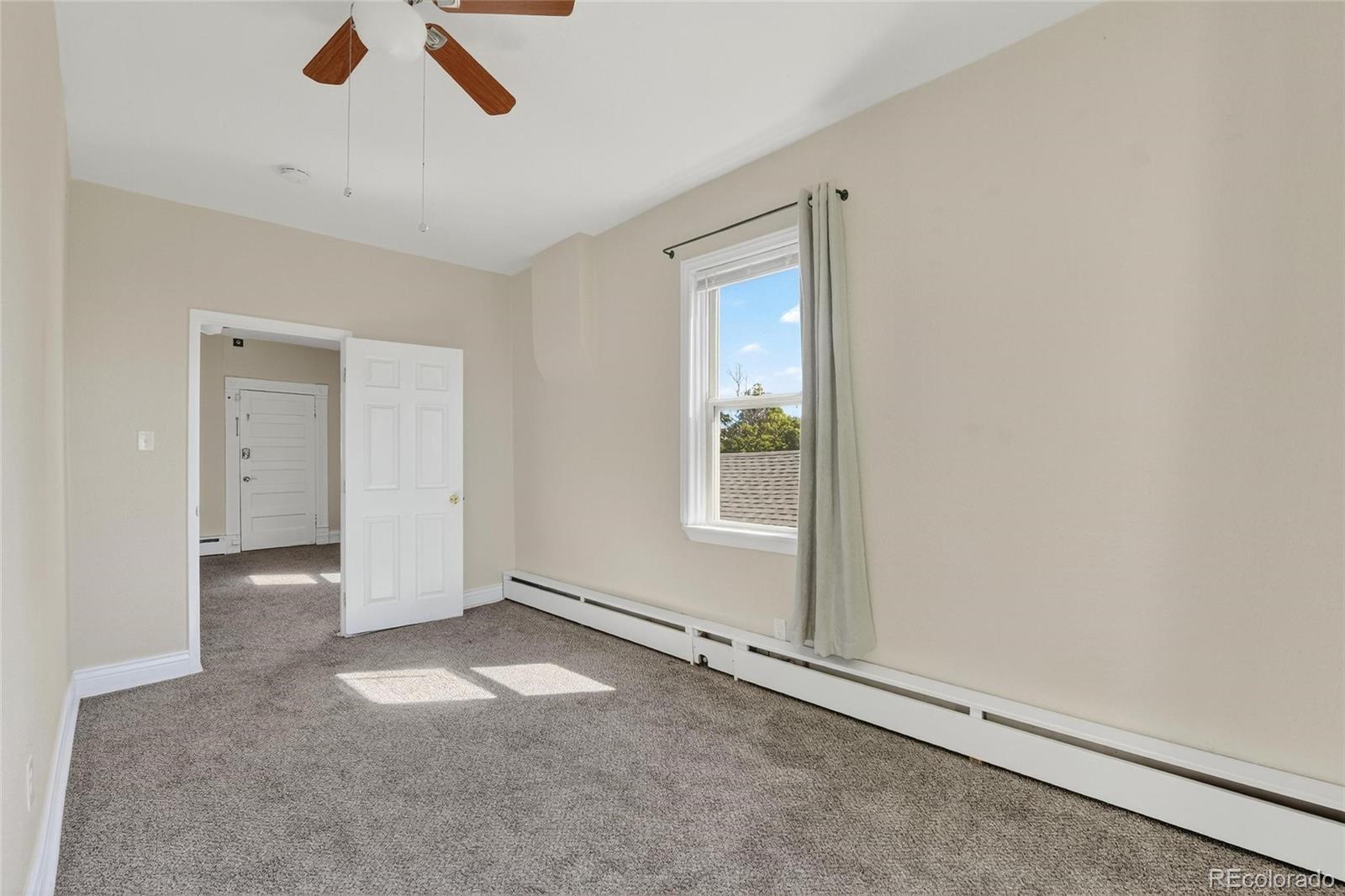 3127 West 28th Avenue, Unit 2 Denver, CO 80211 - Photo 2 of 30 an empty room with a empty space and windows