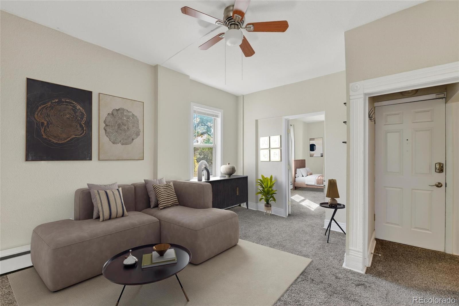 3127 West 28th Avenue, Unit 2 Denver, CO 80211 - Photo 21 of 30 a living room with furniture and a rug