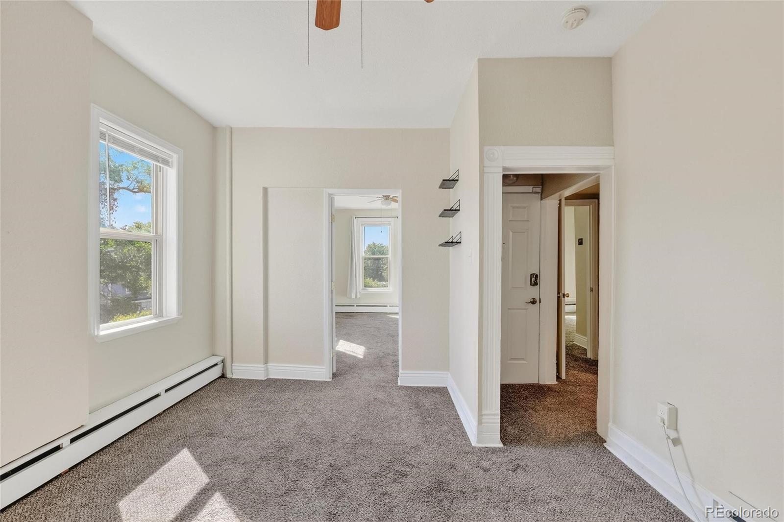 3127 West 28th Avenue, Unit 2 Denver, CO 80211 - Photo 24 of 30 an empty room with windows and closet