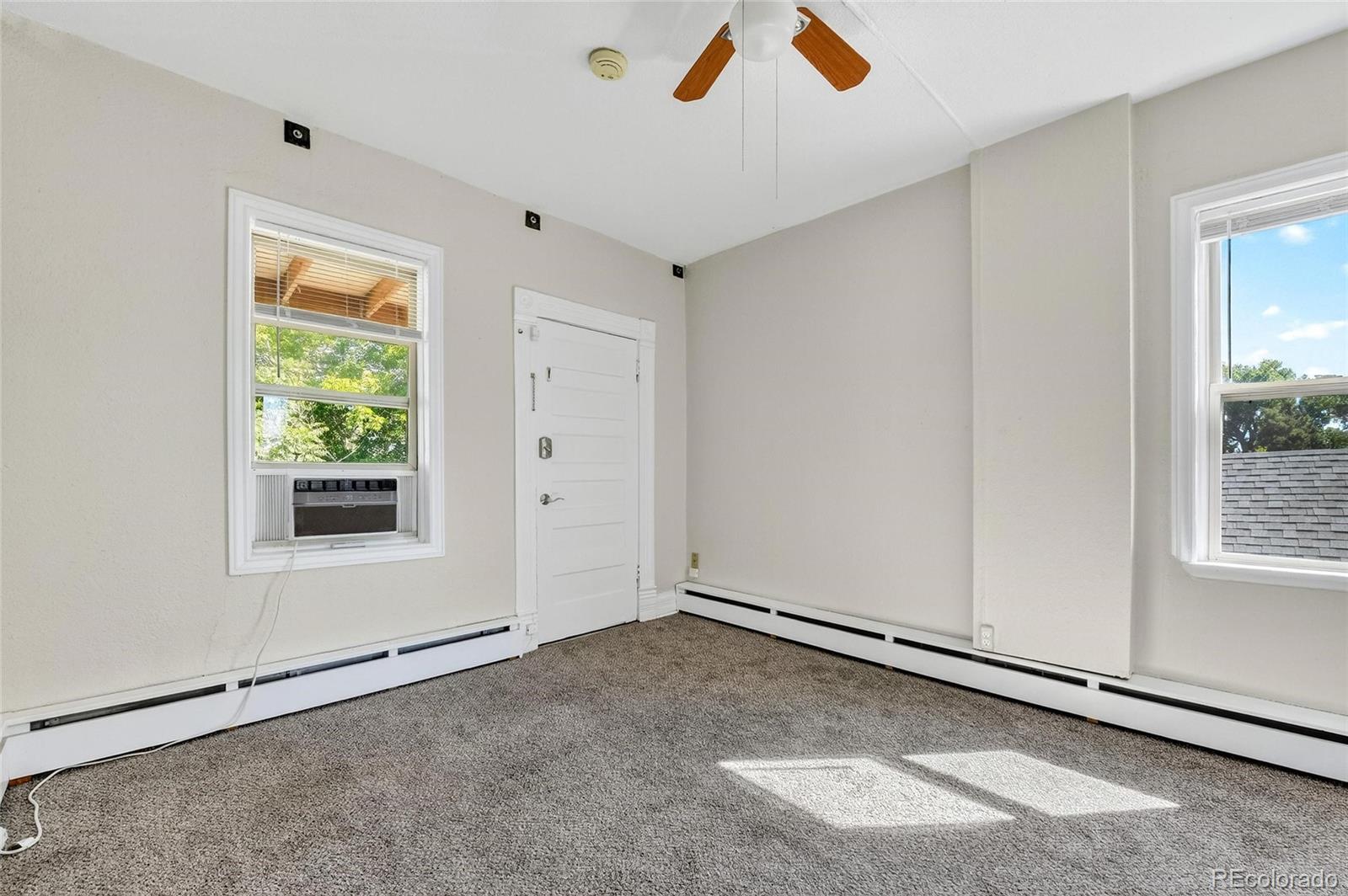 3127 West 28th Avenue, Unit 2 Denver, CO 80211 - Photo 26 of 30 a view of an empty room with a window