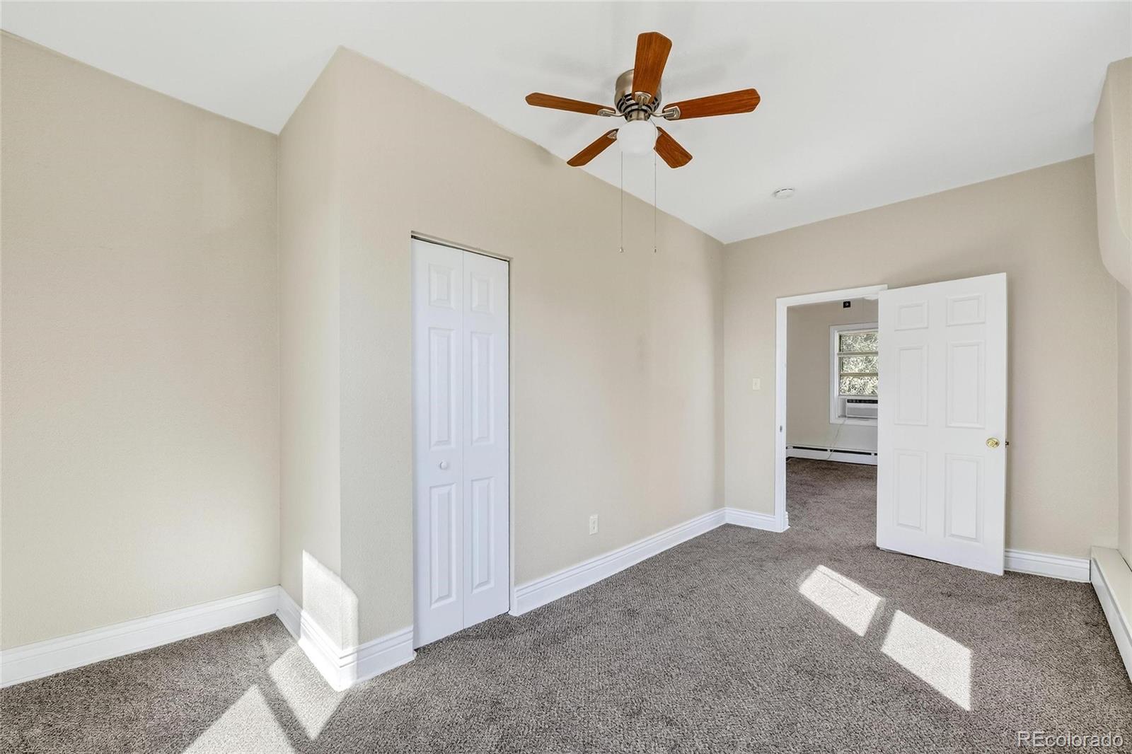 3127 West 28th Avenue, Unit 2 Denver, CO 80211 - Photo 29 of 30 a view of a livingroom with a ceiling fan