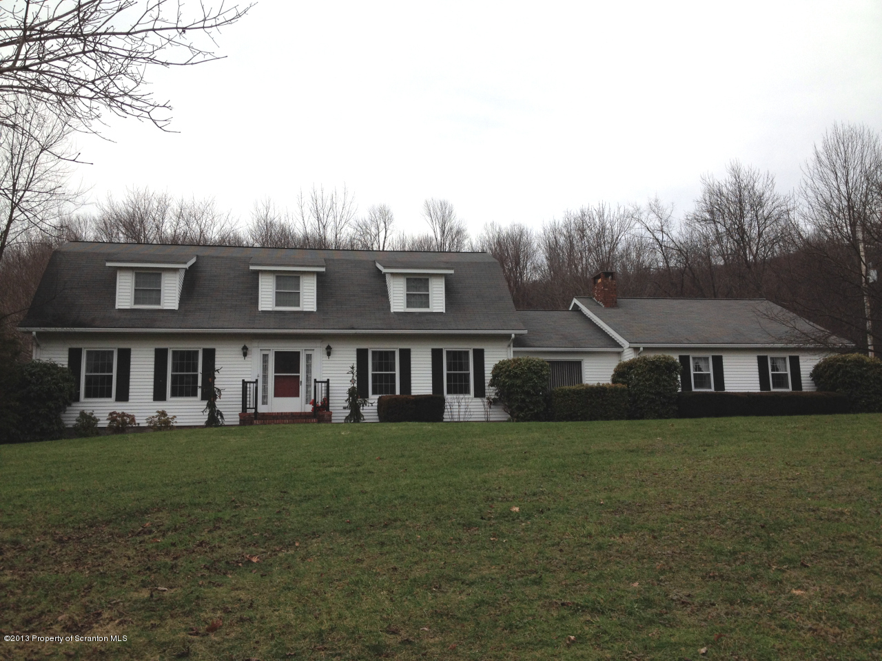 276 Lane Hill Road Tunkhannock, PA 18657 - Photo 1 of 13 a view of a house with a big yard and large trees