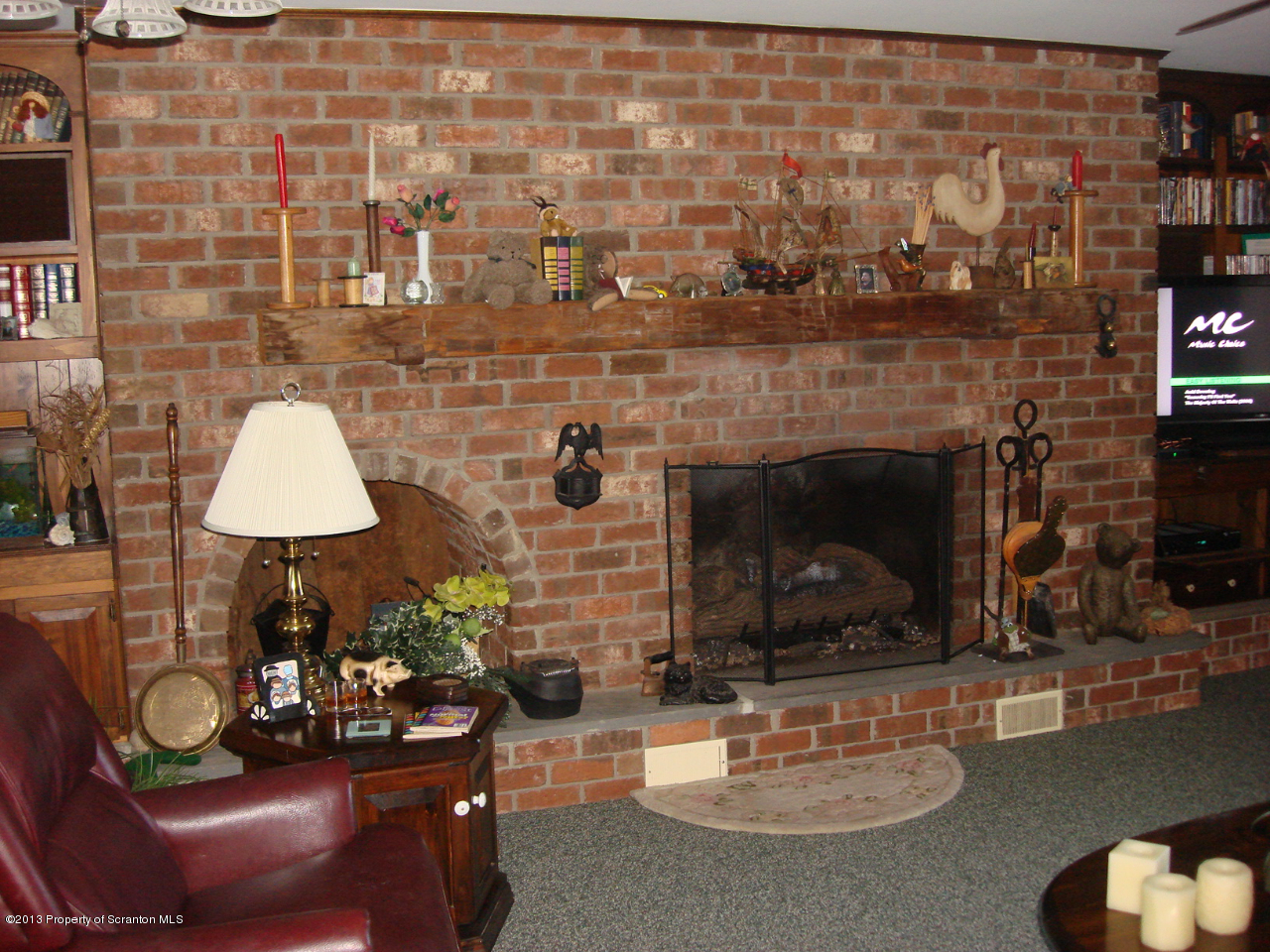 276 Lane Hill Road Tunkhannock, PA 18657 - Photo 2 of 13 a living room with furniture and a fireplace
