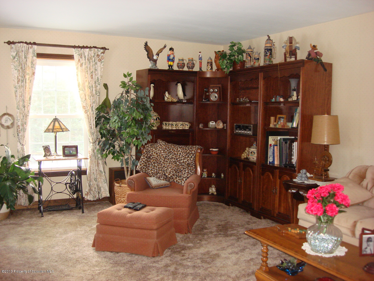 276 Lane Hill Road Tunkhannock, PA 18657 - Photo 4 of 13 a living room with furniture a chandelier and a wooden floor