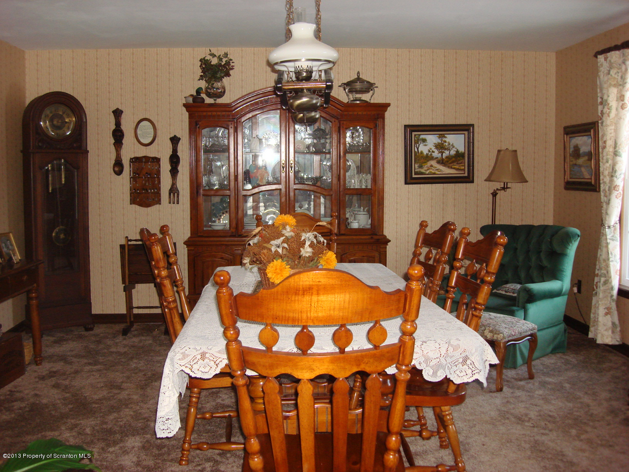 276 Lane Hill Road Tunkhannock, PA 18657 - Photo 7 of 13 a view of a dining room with furniture and chandelier