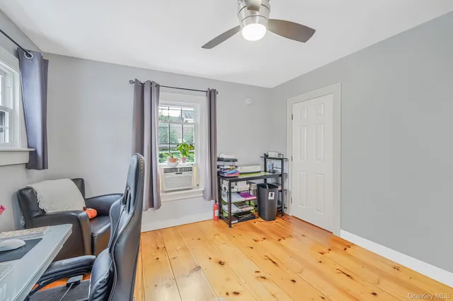 a bed room with a bed and a chair