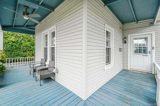 a view of a deck with wooden floor and furniture