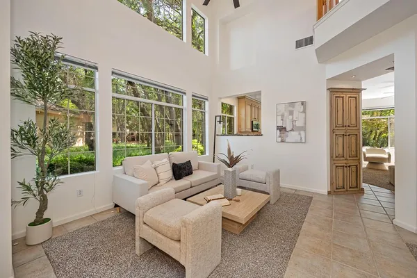 a living room with furniture and a large window