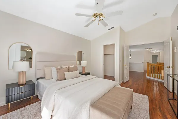 a bedroom with a bed and a table