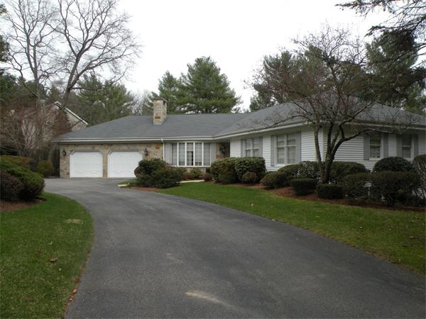 47 Algonquin Road Canton, MA 02021 - Photo 2 of 16 a front view of a house with a garden and trees