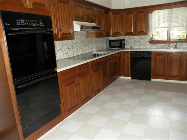 47 Algonquin Road Canton, MA 02021 - Photo 8 of 16 a kitchen with a sink a stove and cabinets