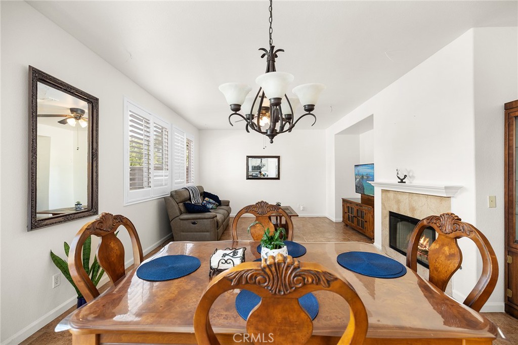 1427 Marble Canyon Way Chula Vista, CA 91915 - Photo 13 of 60 a dining room with furniture and wooden floor