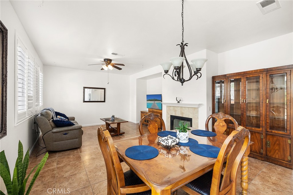 1427 Marble Canyon Way Chula Vista, CA 91915 - Photo 14 of 60 a view of a dining room with furniture window and wooden floor