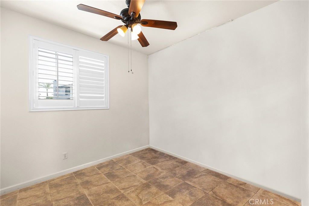 1427 Marble Canyon Way Chula Vista, CA 91915 - Photo 19 of 60 an empty room with a window and a fan