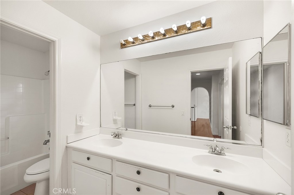 1427 Marble Canyon Way Chula Vista, CA 91915 - Photo 29 of 60 a bathroom with a sink and a mirror