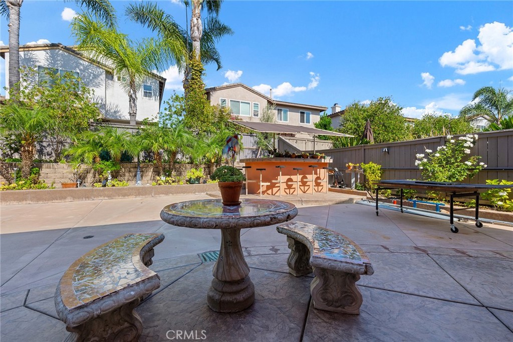 1427 Marble Canyon Way Chula Vista, CA 91915 - Photo 40 of 60 a view of a patio with table and chairs and potted plants