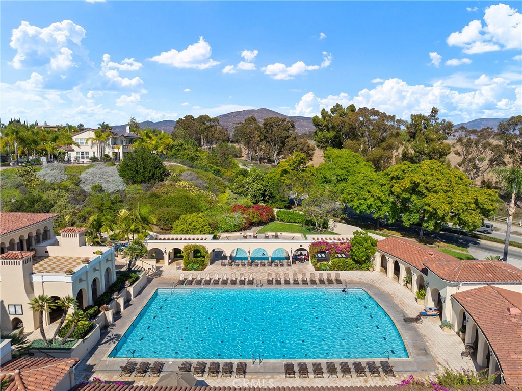 1427 Marble Canyon Way Chula Vista, CA 91915 - Photo 52 of 60 a view of a swimming pool with a patio and a garden