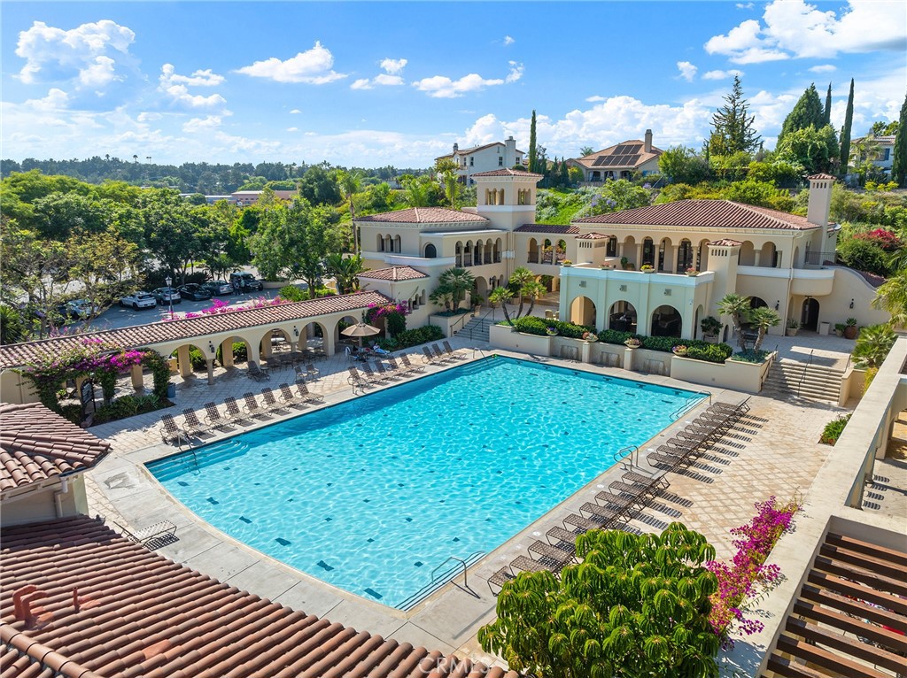 1427 Marble Canyon Way Chula Vista, CA 91915 - Photo 55 of 60 a view of a swimming pool with a patio and a garden
