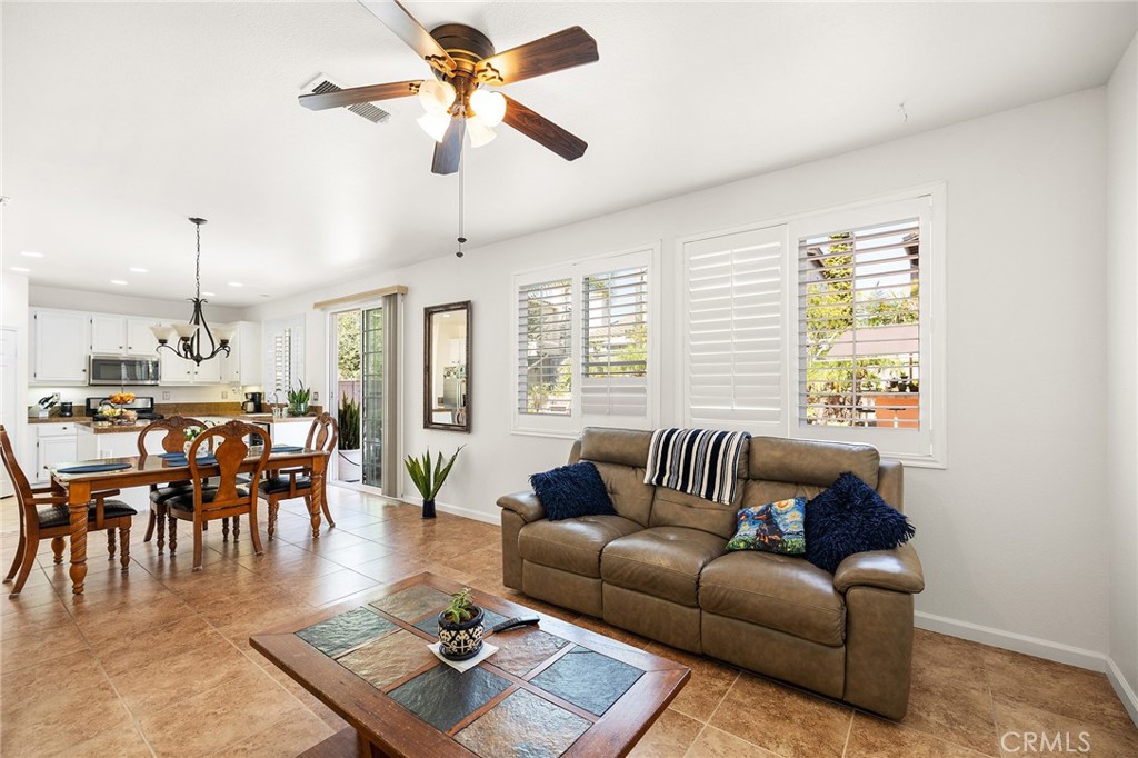 1427 Marble Canyon Way Chula Vista, CA 91915 - Photo 8 of 60 a living room with furniture kitchen view and a large window