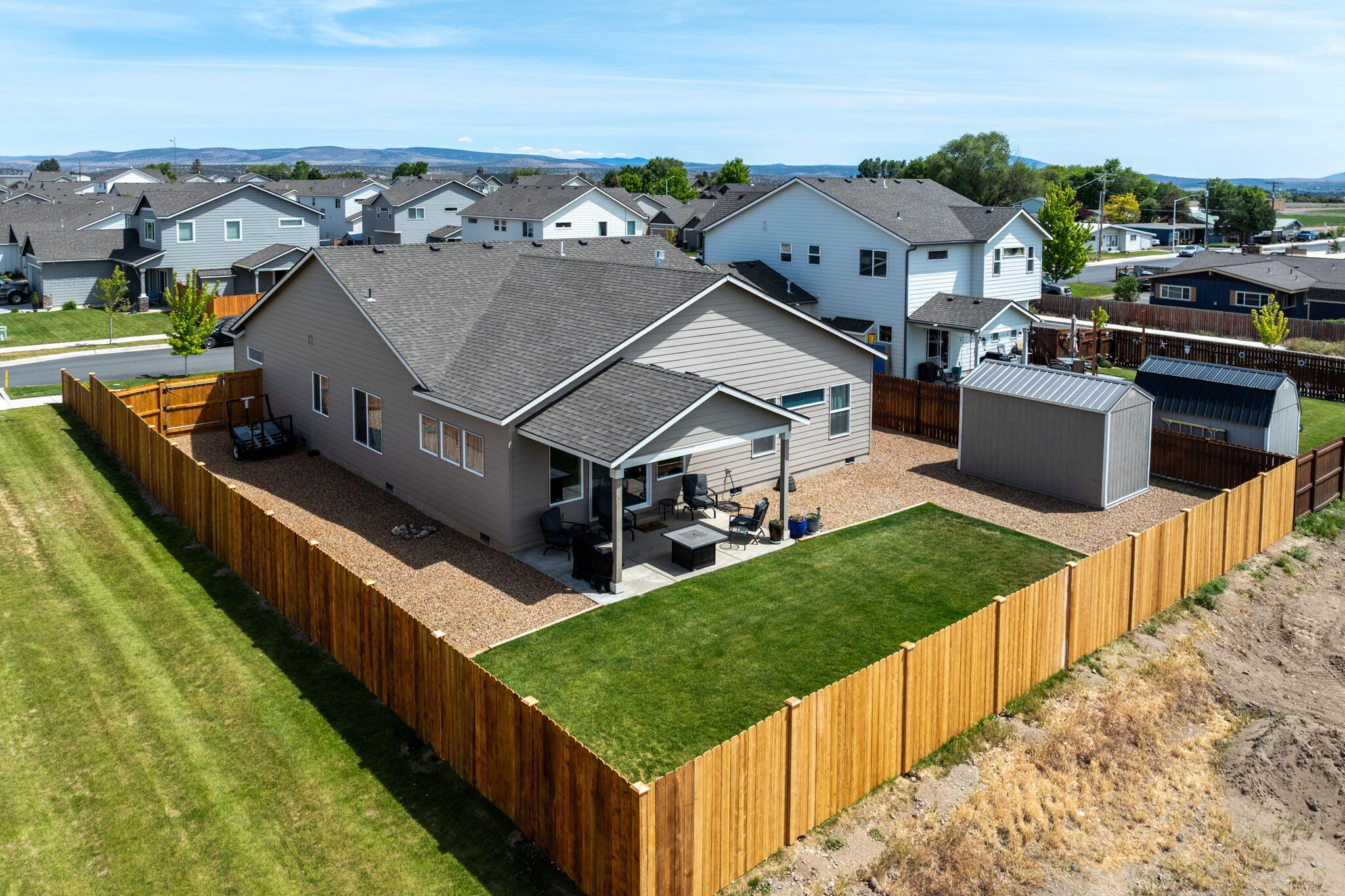 1132 Northwest Golf Course Drive Madras, OR 97741 - Photo 3 of 36 a view of a house in front of a city