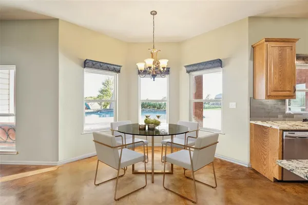 a dining room with furniture and window