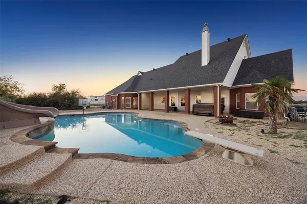 a view of a house with a swimming pool