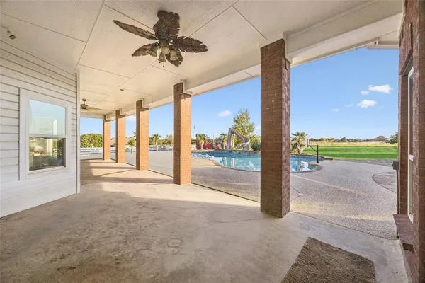a view of an entryway with a floor to ceiling window