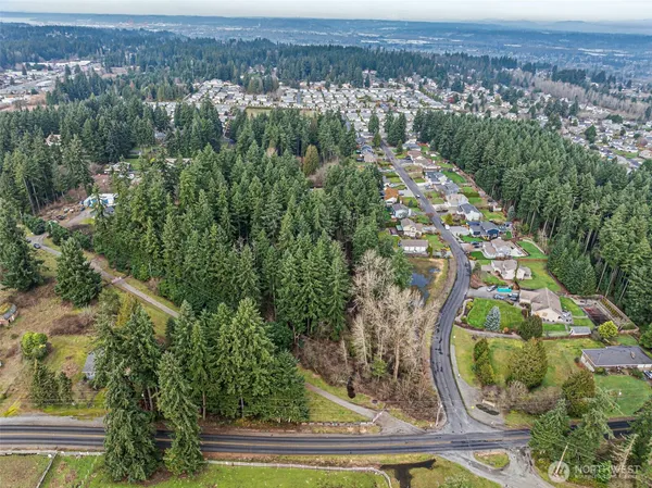 an aerial view of a house with a yard
