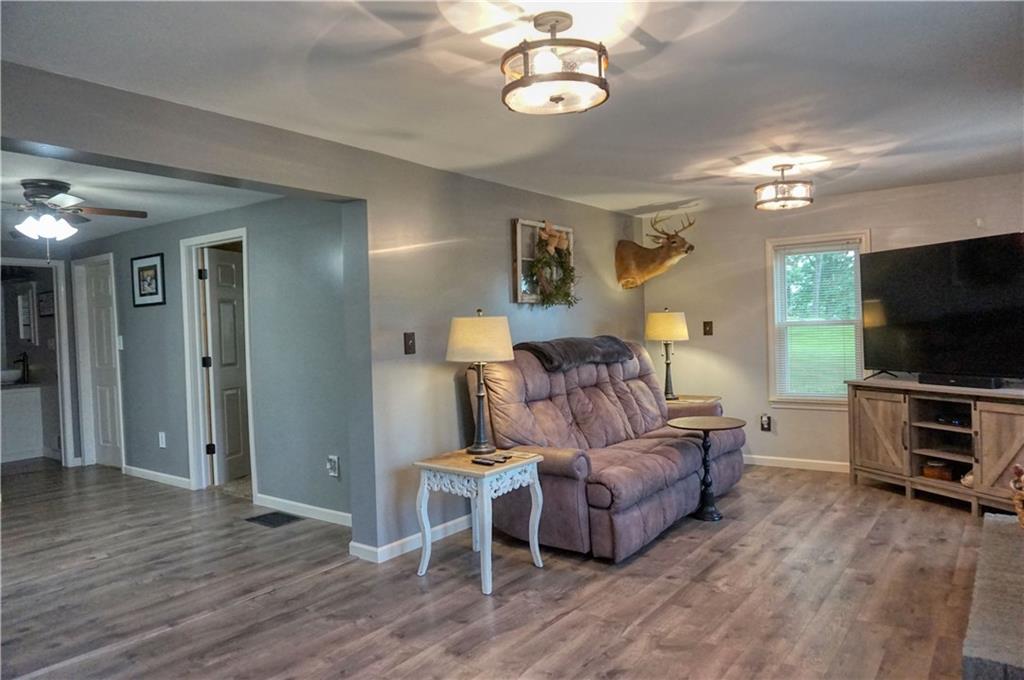 842 Pittsburgh Road Butler, PA 16002 - Photo 14 of 25 Spacious living area with new laminate flooring and new windows!