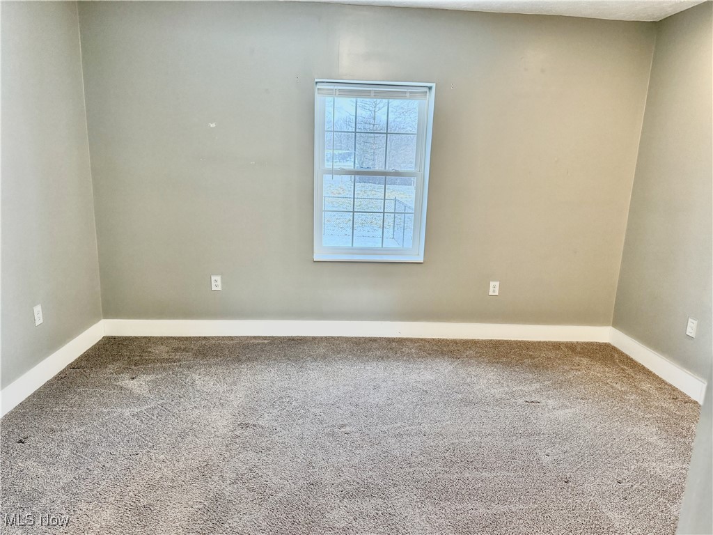 3024 Dutt Road Barberton, OH 44203 - Photo 31 of 33 BEDROOM #1! BRIGHT AND CLEAN! VIEW FROM THE LIVING ROOM, MASTER BATH JUST BEHIND.