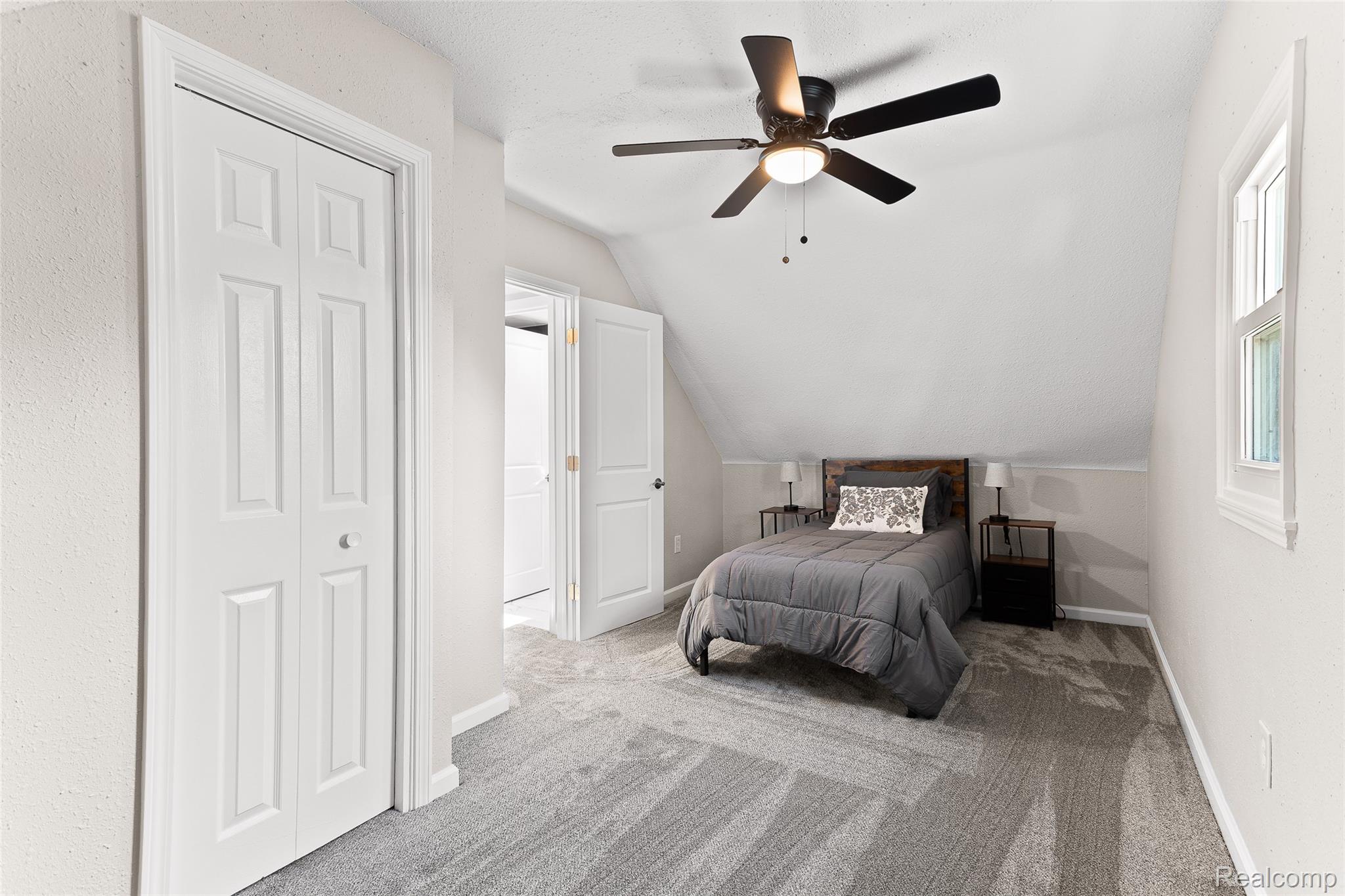 35025 Wick Road Romulus, MI 48174 - Photo 15 of 17 Carpeted room featuring a ceiling fan with integrated lighting, a single window, and white bi-fold closet doors