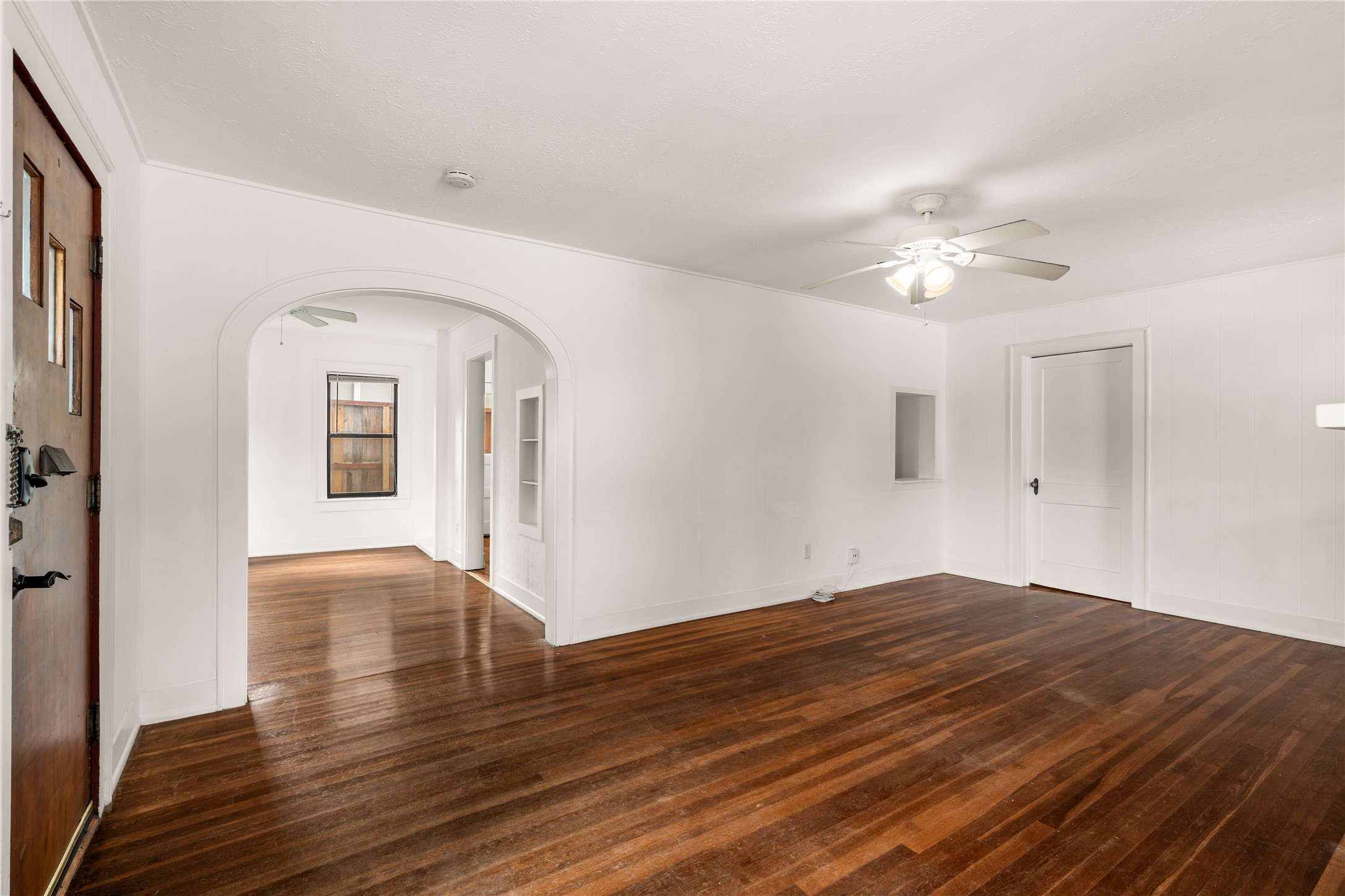 2202 West Main Street Houston, TX 77098 - Photo 4 of 32 a view of empty room with wooden floor and fan