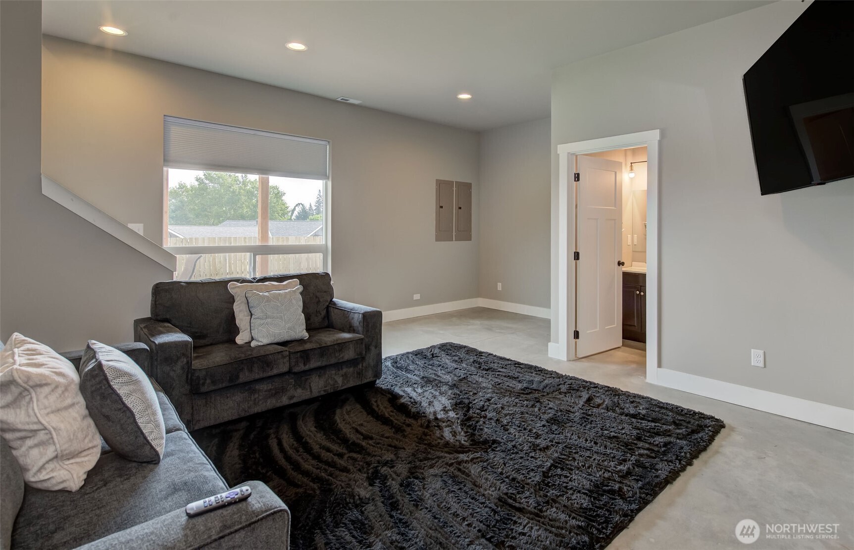 1900 Cumbo Court Wenatchee, WA 98801 - Photo 11 of 33 a living room with furniture and a flat screen tv