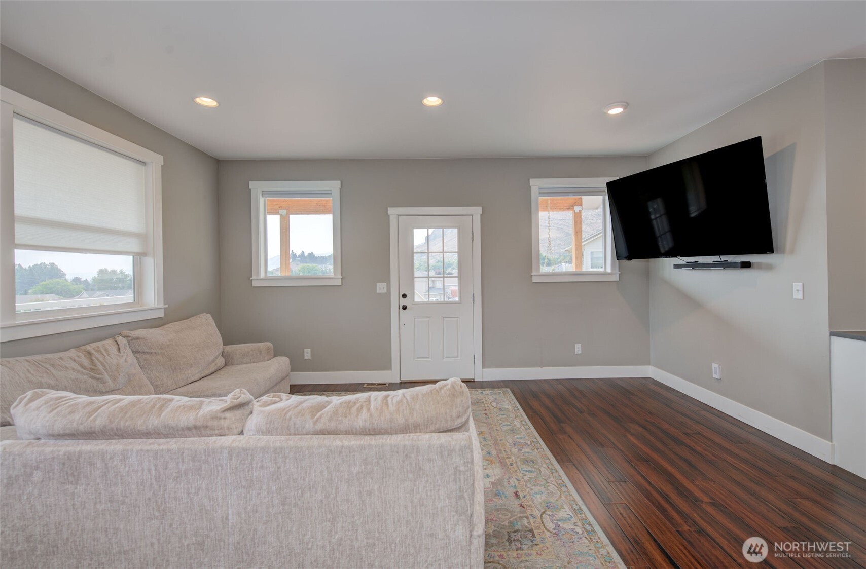 1900 Cumbo Court Wenatchee, WA 98801 - Photo 6 of 33 a living room with furniture and a flat screen tv